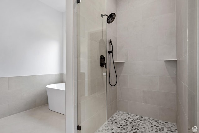 310 S Autumn Blaze Cir, Woodland Hills, UT 84653 - bathroom with separate shower and tub and tile walls