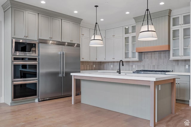 310 S Autumn Blaze Cir, Woodland Hills, UT 84653 - kitchen featuring pendant lighting, an island with sink, gray cabinetry, backsplash, and built in appliances