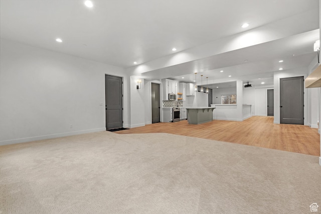 310 S Autumn Blaze Cir, Woodland Hills, UT 84653 - unfurnished living room featuring light carpet