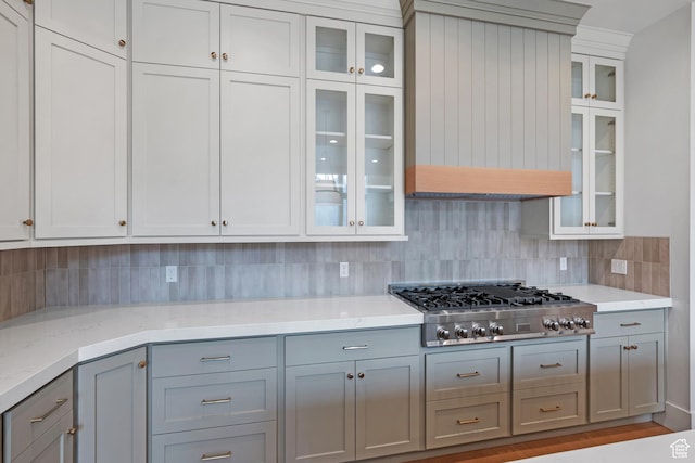 310 S Autumn Blaze Cir, Woodland Hills, UT 84653 - kitchen featuring gray cabinetry, backsplash, stainless steel gas stovetop, and premium range hood