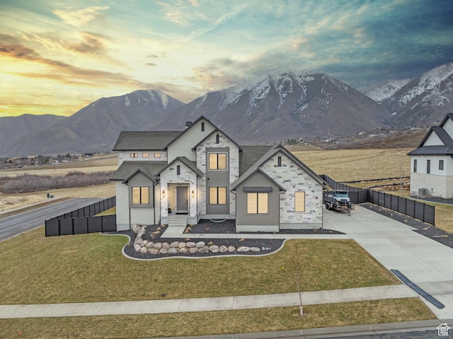 310 S Autumn Blaze Cir, Woodland Hills, UT 84653 - view of front of home with a mountain view, central AC unit, and a lawn