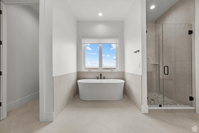310 S Autumn Blaze Cir, Woodland Hills, UT 84653 - bathroom featuring tile walls, tile patterned floors, and independent shower and bath