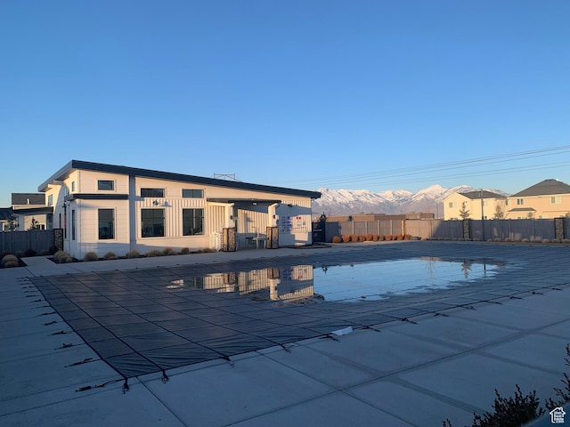 4694 E Lake Corner Dr, Eagle Mountain, UT 84005 - view of swimming pool featuring a patio area, a mountain view, and fence