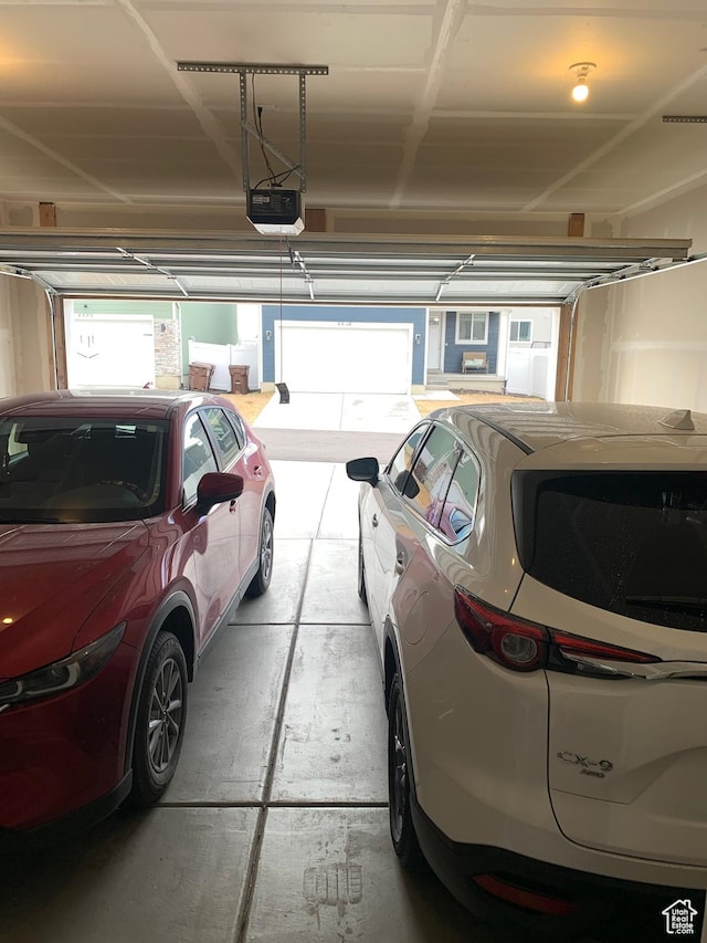 4694 E Lake Corner Dr, Eagle Mountain, UT 84005 - garage featuring a garage door opener