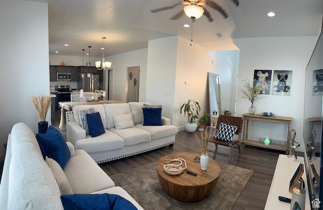 4694 E Lake Corner Dr, Eagle Mountain, UT 84005 - living room featuring recessed lighting, dark wood-style flooring, and ceiling fan with notable chandelier