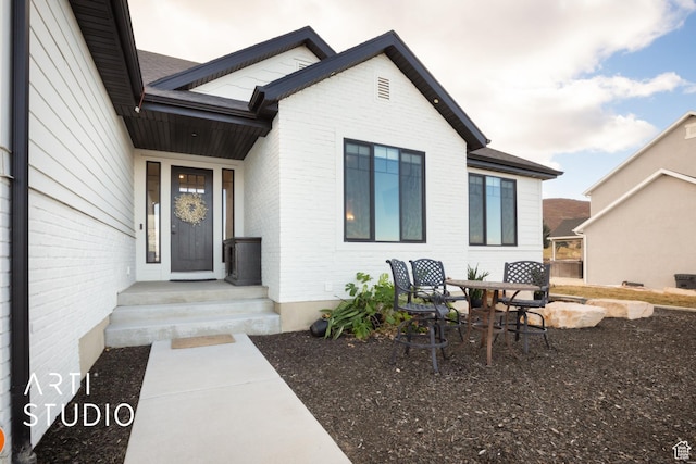 429 W Olympic Ln, Elk Ridge, UT 84651 - doorway to property featuring brick siding