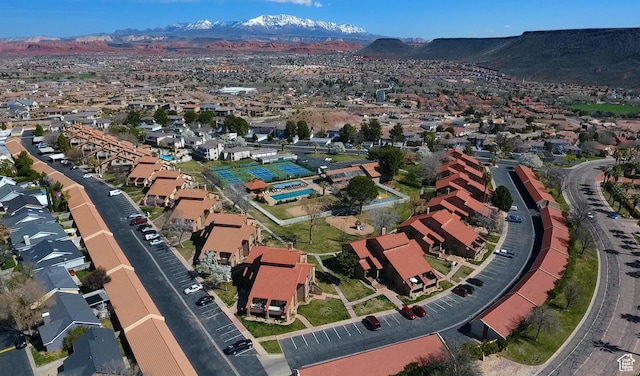 birds eye view of property with a mountain view