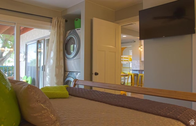 interior space featuring stacked washing maching and dryer