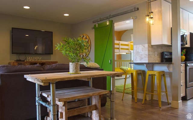 dining space featuring wood-type flooring