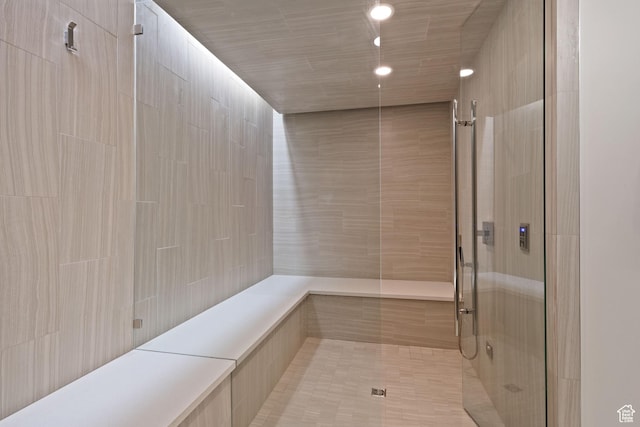 bathroom with tiled shower