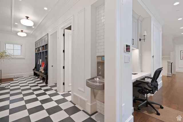office space with ornamental molding