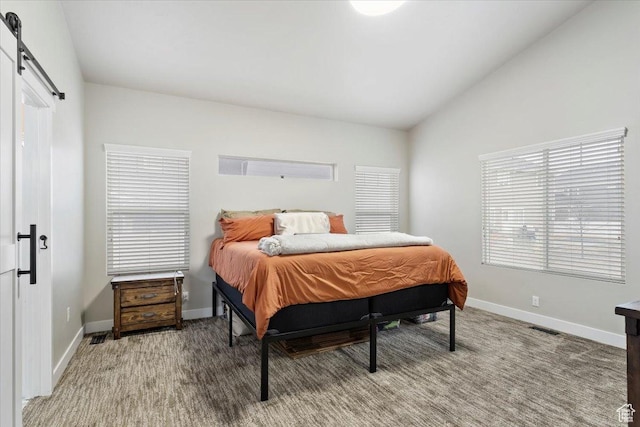 7160 S 1100 E, South Weber, UT 84405 - bedroom featuring vaulted ceiling, a barn door, and carpet flooring