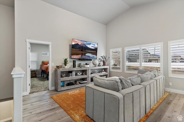 7160 S 1100 E, South Weber, UT 84405 - living room featuring light wood-type flooring and high vaulted ceiling