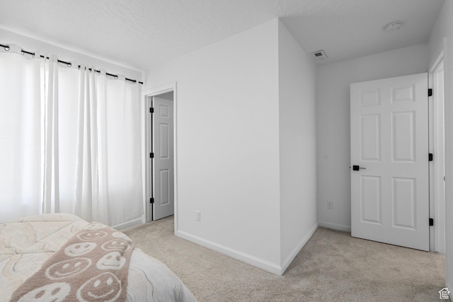 bedroom with light carpet