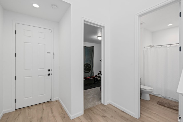 foyer entrance with light wood-type flooring