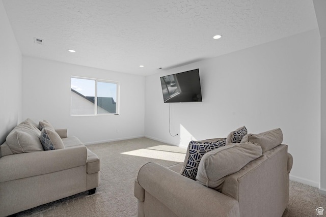 living room with light colored carpet and a textured ceiling