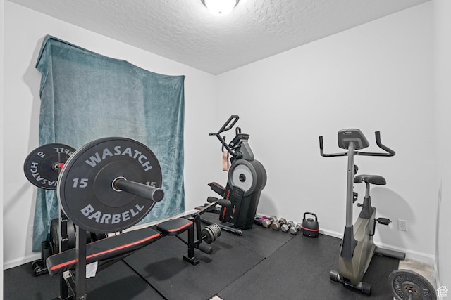exercise area with a textured ceiling