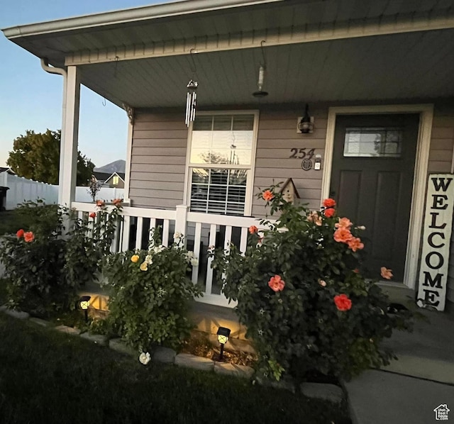 property entrance featuring covered porch