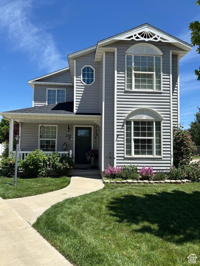254 N 700 W, Spanish Fork, UT 84660 - view of front of house featuring a front lawn and covered porch