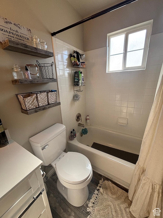 bathroom with shower / bath combo, toilet, and vanity
