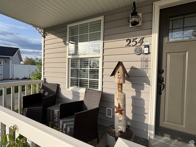 property entrance with covered porch