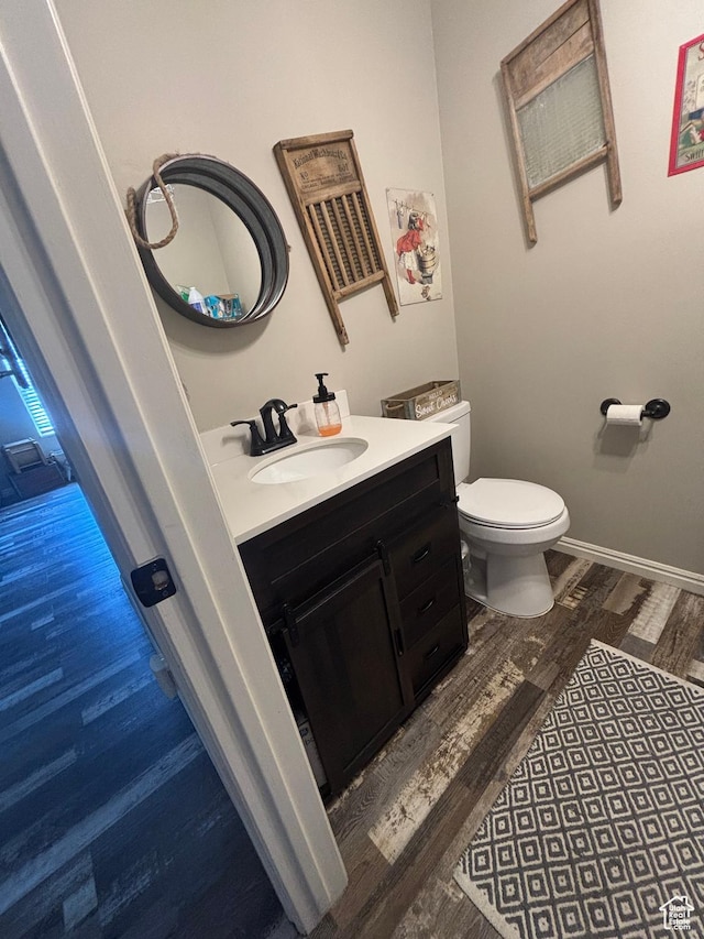 254 N 700 W, Spanish Fork, UT 84660 - bathroom with vanity, toilet, wood finished floors, and baseboards