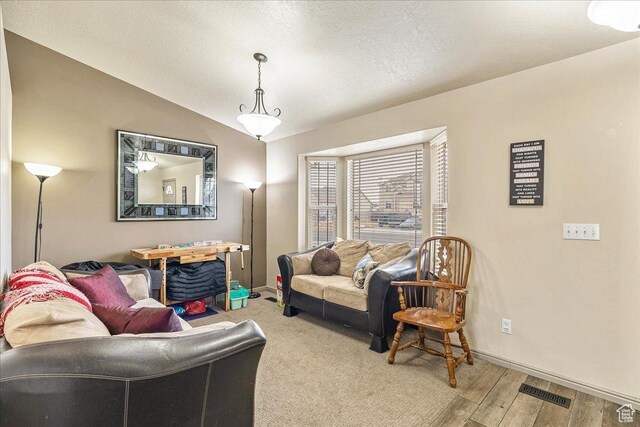 4323 W 25 S, West Point, UT 84015 - living room featuring lofted ceiling, wood-type flooring, and a textured ceiling