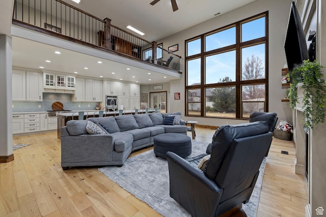 1532 W 3500 N, Pleasant Grove, UT 84062 - living area featuring a high ceiling, a ceiling fan, light wood-style floors, and recessed lighting