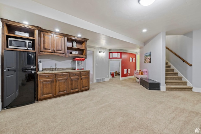 1532 W 3500 N, Pleasant Grove, UT 84062 - kitchen featuring open shelves, freestanding refrigerator, stainless steel microwave, light colored carpet, and baseboards