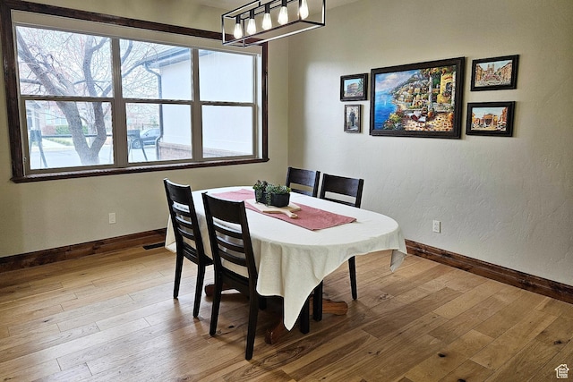 1532 W 3500 N, Pleasant Grove, UT 84062 - dining space featuring baseboards, wood-type flooring, and a chandelier