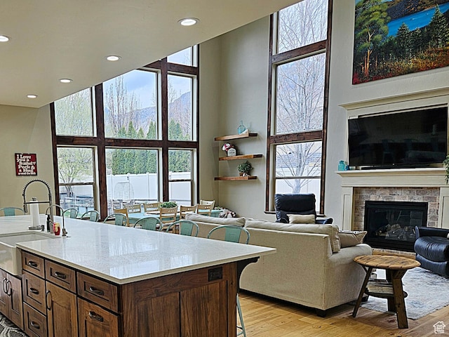 1532 W 3500 N, Pleasant Grove, UT 84062 - kitchen with a sink, a towering ceiling, a kitchen bar, light countertops, and recessed lighting