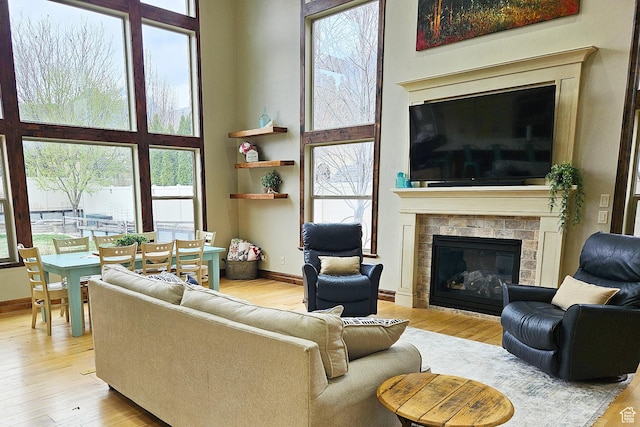 1532 W 3500 N, Pleasant Grove, UT 84062 - living room with wood finished floors and a glass covered fireplace