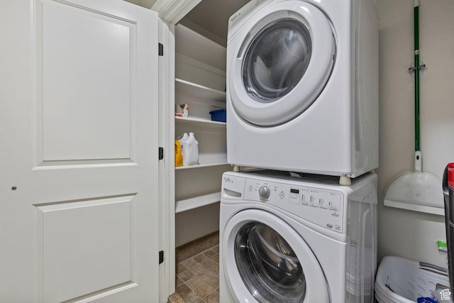 1532 W 3500 N, Pleasant Grove, UT 84062 - laundry area featuring stacked washer and clothes dryer and stone finish flooring