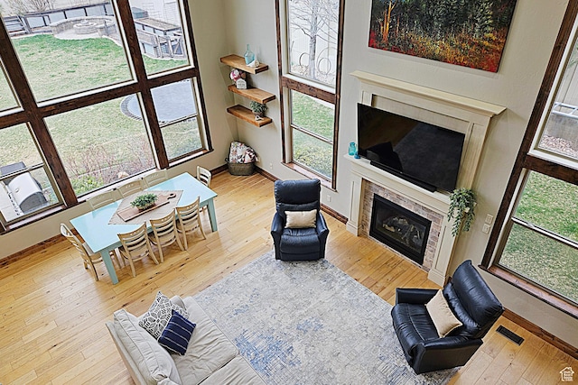 1532 W 3500 N, Pleasant Grove, UT 84062 - living area featuring a fireplace, hardwood / wood-style floors, and baseboards