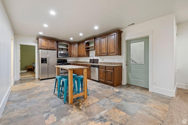 1532 W 3500 N, Pleasant Grove, UT 84062 - kitchen with appliances with stainless steel finishes, open shelves, baseboards, stone tile flooring, and recessed lighting