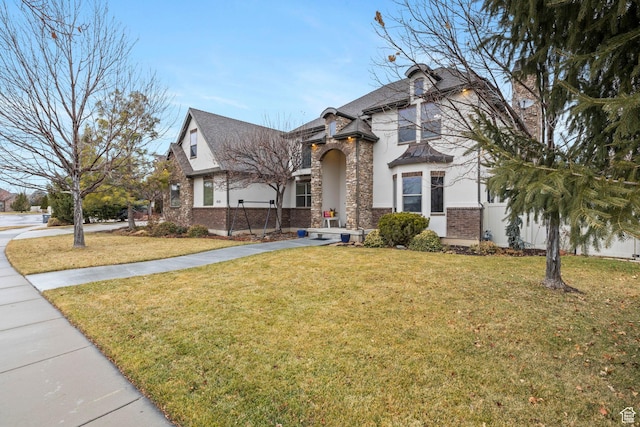 1532 W 3500 N, Pleasant Grove, UT 84062 - view of front facade with a front yard, brick siding, and roof with shingles