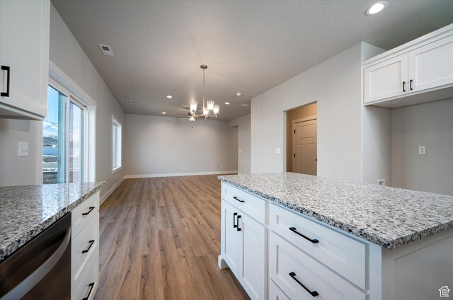 1357 N 450 W Unit 50, Brigham City, UT 84302 - kitchen with dishwasher, hanging light fixtures, a notable chandelier, light stone countertops, and white cabinets