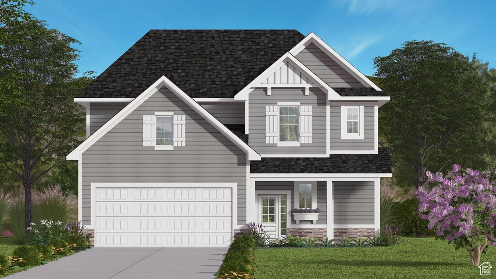 224 E 650 S, Hyde Park, UT 84318 - view of front facade with a garage and a front yard