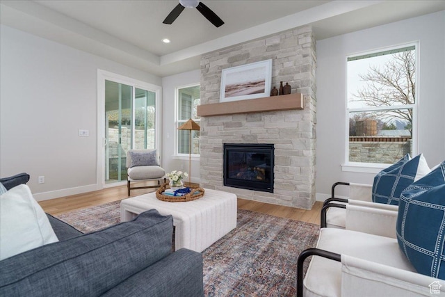 2998 N 1080 W, Lehi, UT 84043 - living room with a stone fireplace, baseboards, wood finished floors, and a ceiling fan