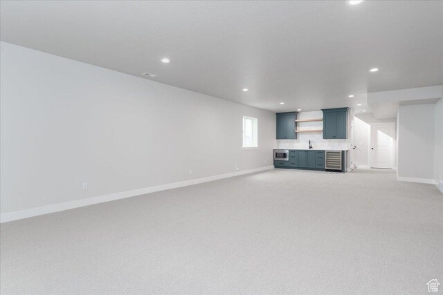 2998 N 1080 W, Lehi, UT 84043 - unfurnished living room featuring a sink, indoor wet bar, baseboards, and recessed lighting