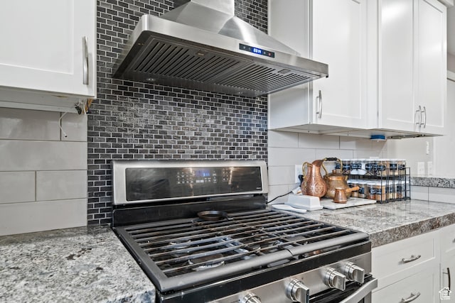 2283 E 7925 S, South Weber, UT 84405 - kitchen with wall chimney exhaust hood, backsplash, stainless steel gas stove, and white cabinetry
