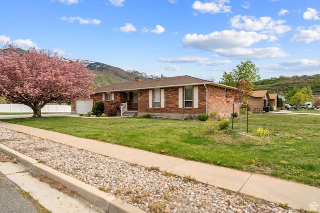 2283 E 7925 S, South Weber, UT 84405 - ranch-style home with brick siding, driveway, a mountain view, and a front yard