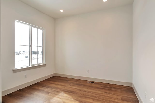 unfurnished room featuring recessed lighting, visible vents, and a healthy amount of sunlight