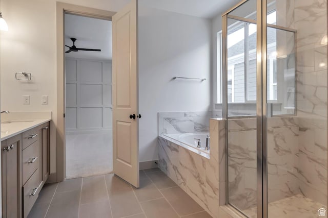 full bathroom featuring vanity, a marble finish shower, ceiling fan, and a garden tub