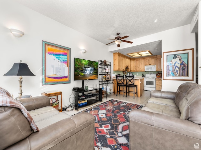 11085 S Grape Arbor Pl Unit 102, Sandy, UT 84070 - living room with ceiling fan, a textured ceiling, and light tile patterned floors