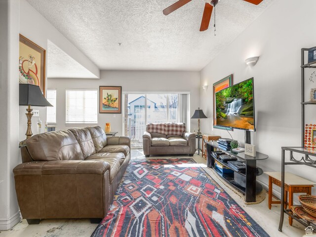 11085 S Grape Arbor Pl Unit 102, Sandy, UT 84070 - living room with ceiling fan, a textured ceiling, and a wealth of natural light