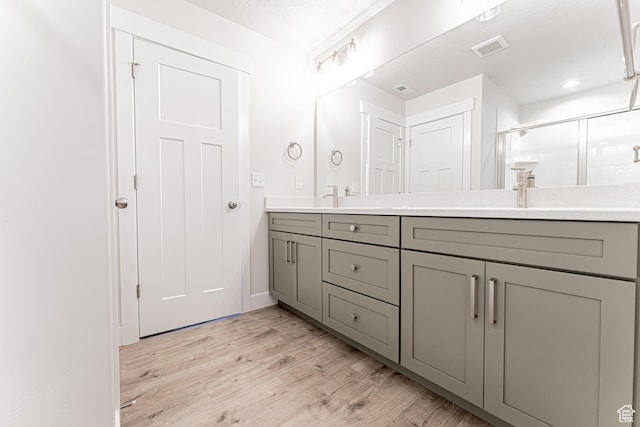 1091 N 3620 W Unit 272, Lehi, UT 84043 - full bath with double vanity, wood finished floors, and a stall shower