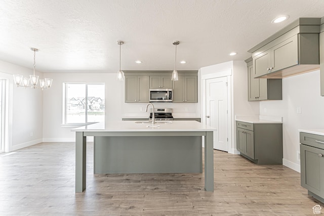 1091 N 3620 W Unit 272, Lehi, UT 84043 - kitchen with stainless steel appliances, gray cabinetry, light countertops, baseboards, and recessed lighting