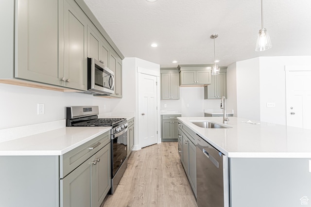 1091 N 3620 W Unit 272, Lehi, UT 84043 - kitchen with appliances with stainless steel finishes, gray cabinetry, a sink, light wood finished floors, and recessed lighting