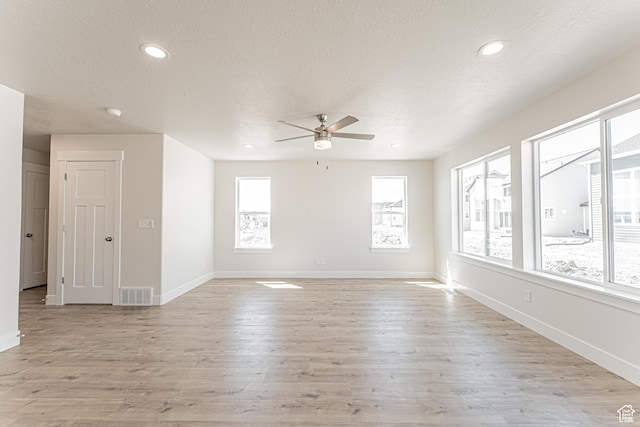 1091 N 3620 W Unit 272, Lehi, UT 84043 - empty room featuring ceiling fan, light wood-style floors, baseboards, a textured ceiling, and recessed lighting